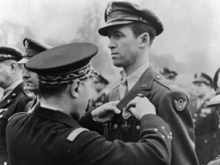 Lt. Gen. Valin, Chief of Staff, French Air Force, awarding Croix De Guerre with palm to Col. James Stewart